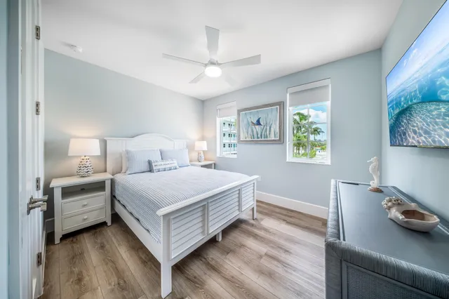 a bedroom with a bed and a table