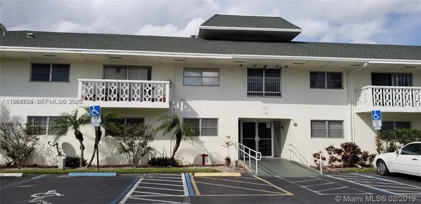 a white refrigerator freezer sitting in a kitchen