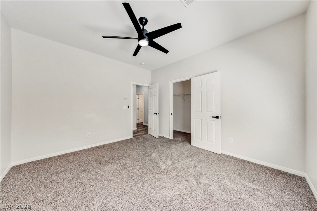 740 Aldo Rae Court, Unit NONE Henderson, NV 89052 - Photo 19 of 35 Well-lit and ready for personalization, this room features soft carpeting and convenient closet access.