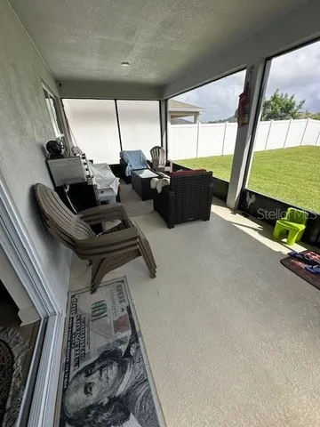 a room with gym equipment and a large window