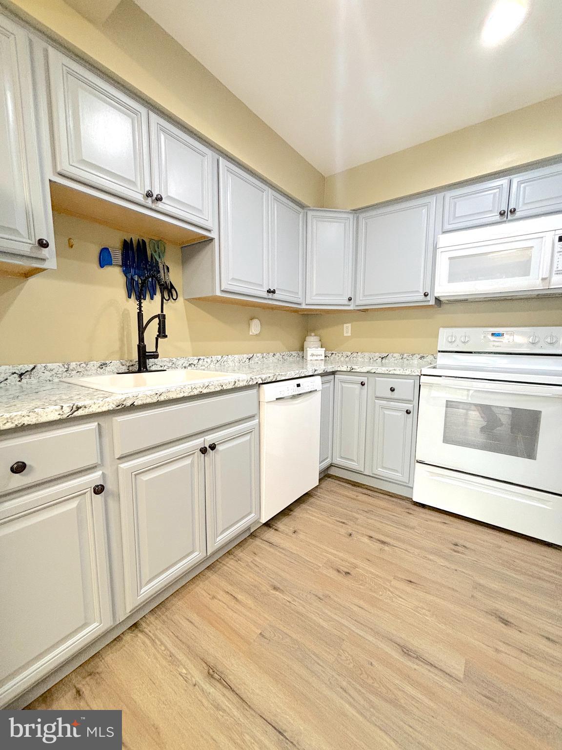 26 Noble Road Sicklerville, NJ 08081 - Photo 4 of 33 a kitchen with stainless steel appliances granite countertop a sink and cabinets