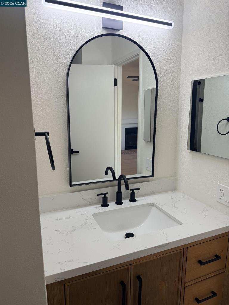 60 Wilson Way Milpitas, CA 95035 - Photo 11 of 22 a bathroom with a sink and a mirror