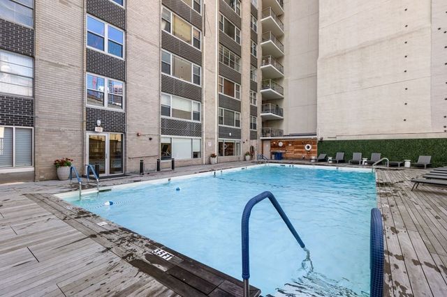 a view of swimming pool with outdoor seating