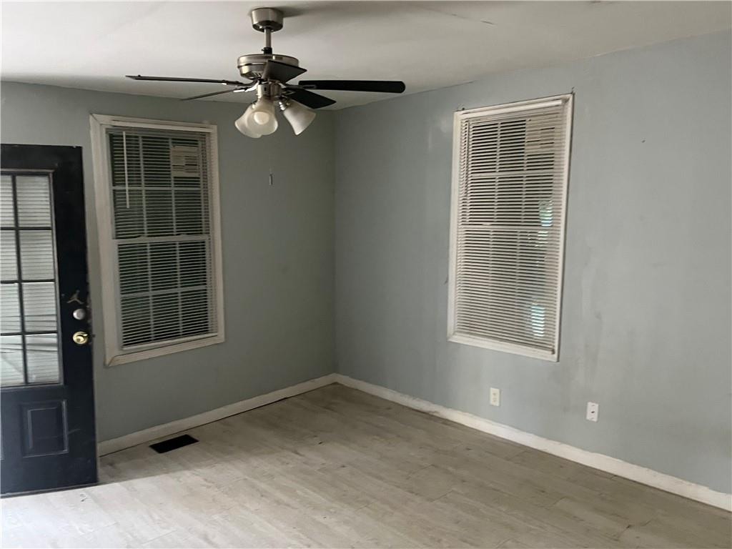 3363 Lake Valley Road Northwest Atlanta, GA 30331 - Photo 4 of 7 an empty room with a window
