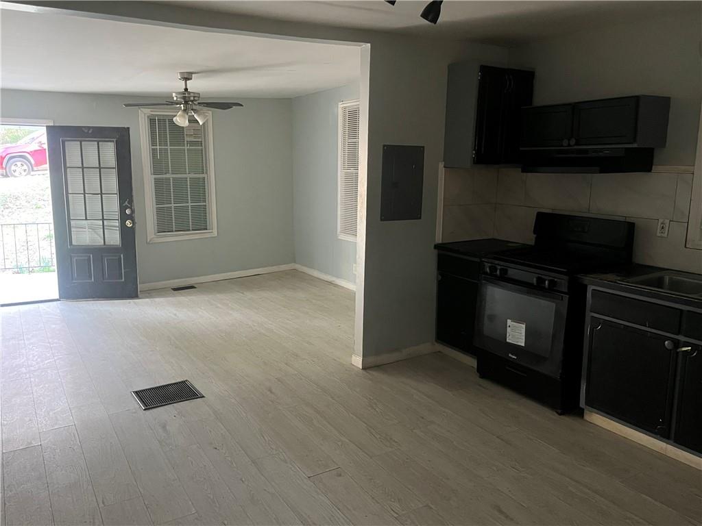 3363 Lake Valley Road Northwest Atlanta, GA 30331 - Photo 7 of 7 a view of a kitchen with an empty space and a window