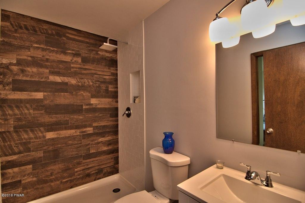 2412 Crest View Road Lake Ariel, PA 18436 - Photo 33 of 50 a bathroom with a toilet and a shower