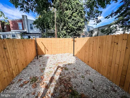 a view of swimming pool with a yard