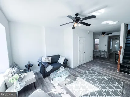 a living room with furniture and a rug