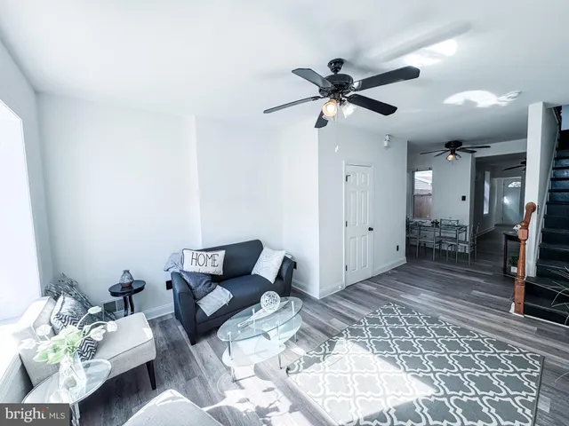 a living room with furniture and a rug