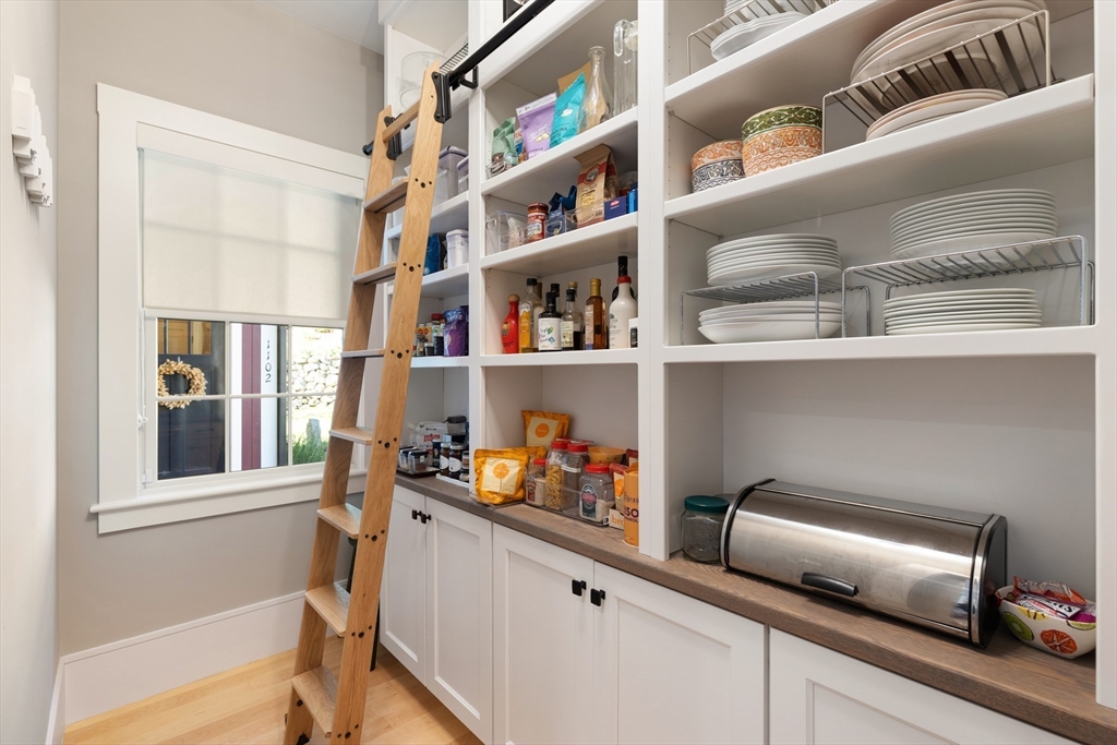 1102 Massachusetts Avenue Lexington, MA 02421 - Photo 14 of 42 a kitchen with a cabinets and a window