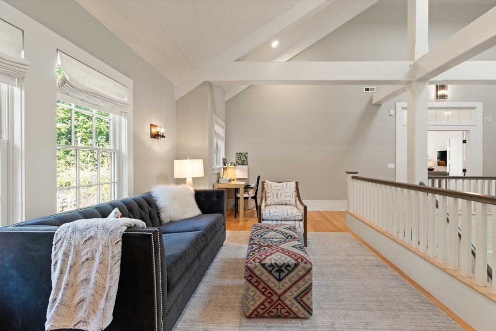 1102 Massachusetts Avenue Lexington, MA 02421 - Photo 20 of 42 a living room with furniture and a window