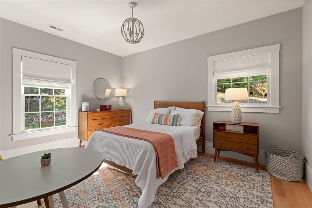 1102 Massachusetts Avenue Lexington, MA 02421 - Photo 25 of 42 a bed room with a bed and a window