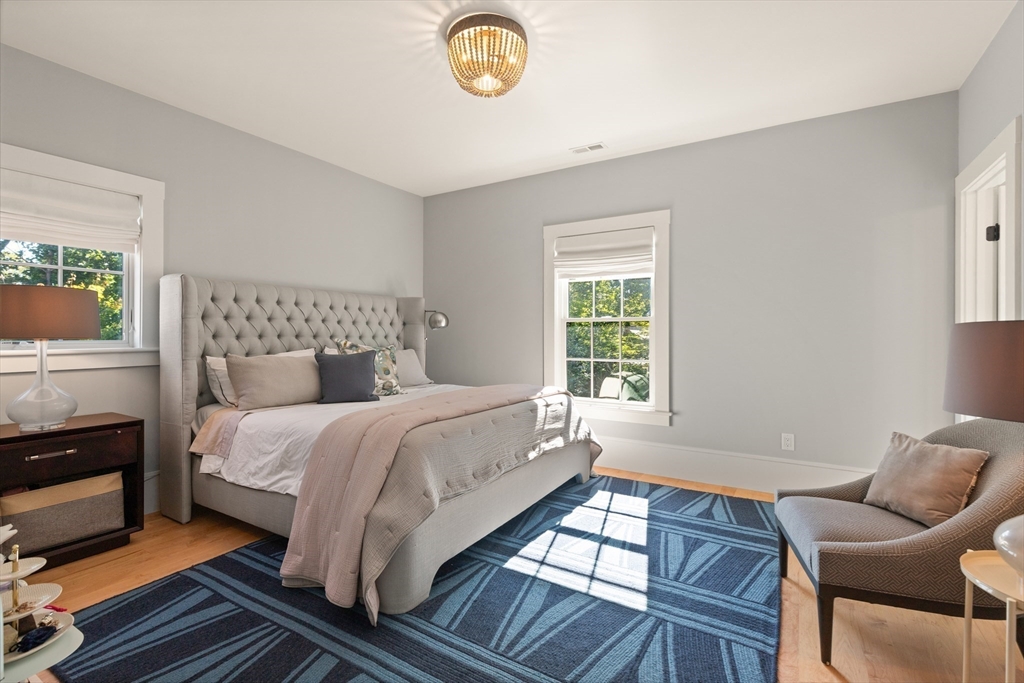 1102 Massachusetts Avenue Lexington, MA 02421 - Photo 29 of 42 a bedroom with a bed and window