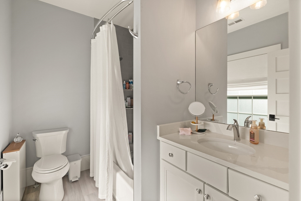 1102 Massachusetts Avenue Lexington, MA 02421 - Photo 30 of 42 a bathroom with a sink toilet and shower