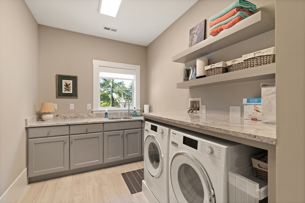 1102 Massachusetts Avenue Lexington, MA 02421 - Photo 31 of 42 a utility room with sink dryer and washer