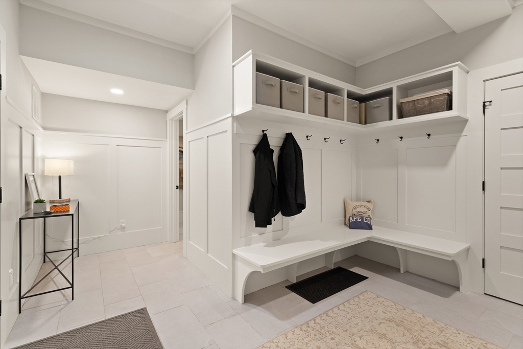 1102 Massachusetts Avenue Lexington, MA 02421 - Photo 32 of 42 a hallway view with furniture and wooden floor