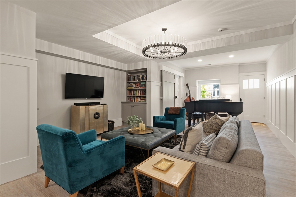 1102 Massachusetts Avenue Lexington, MA 02421 - Photo 34 of 42 a living room with furniture and a flat screen tv