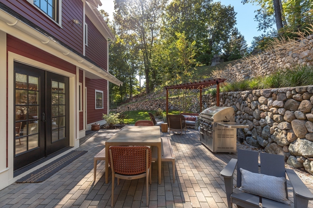 1102 Massachusetts Avenue Lexington, MA 02421 - Photo 36 of 42 a patio with patio a couch and chairs