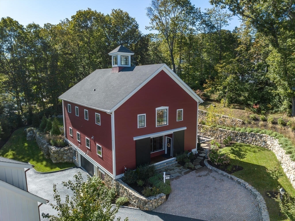 1102 Massachusetts Avenue Lexington, MA 02421 - Photo 40 of 42 a view of a house with a yard plants and large tree