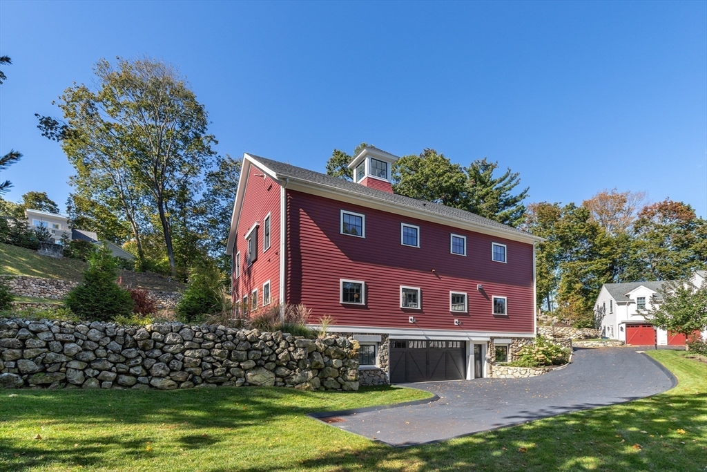 1102 Massachusetts Avenue Lexington, MA 02421 - Photo 41 of 42 a view of a brick house with a yard
