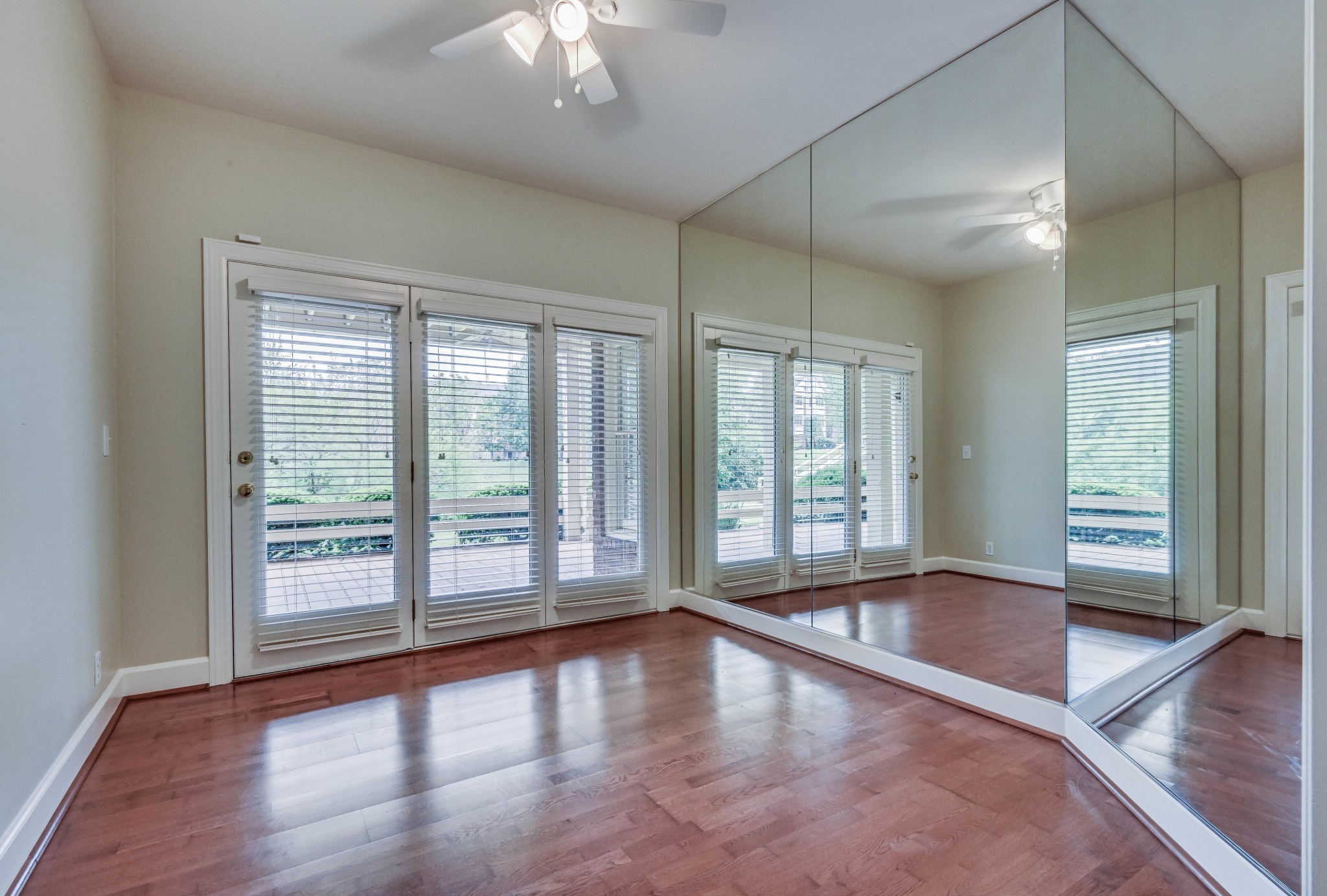 301 Boxmere Place Nashville, TN 37215 - Photo 17 of 40 a view of an empty room with wooden floor and a window