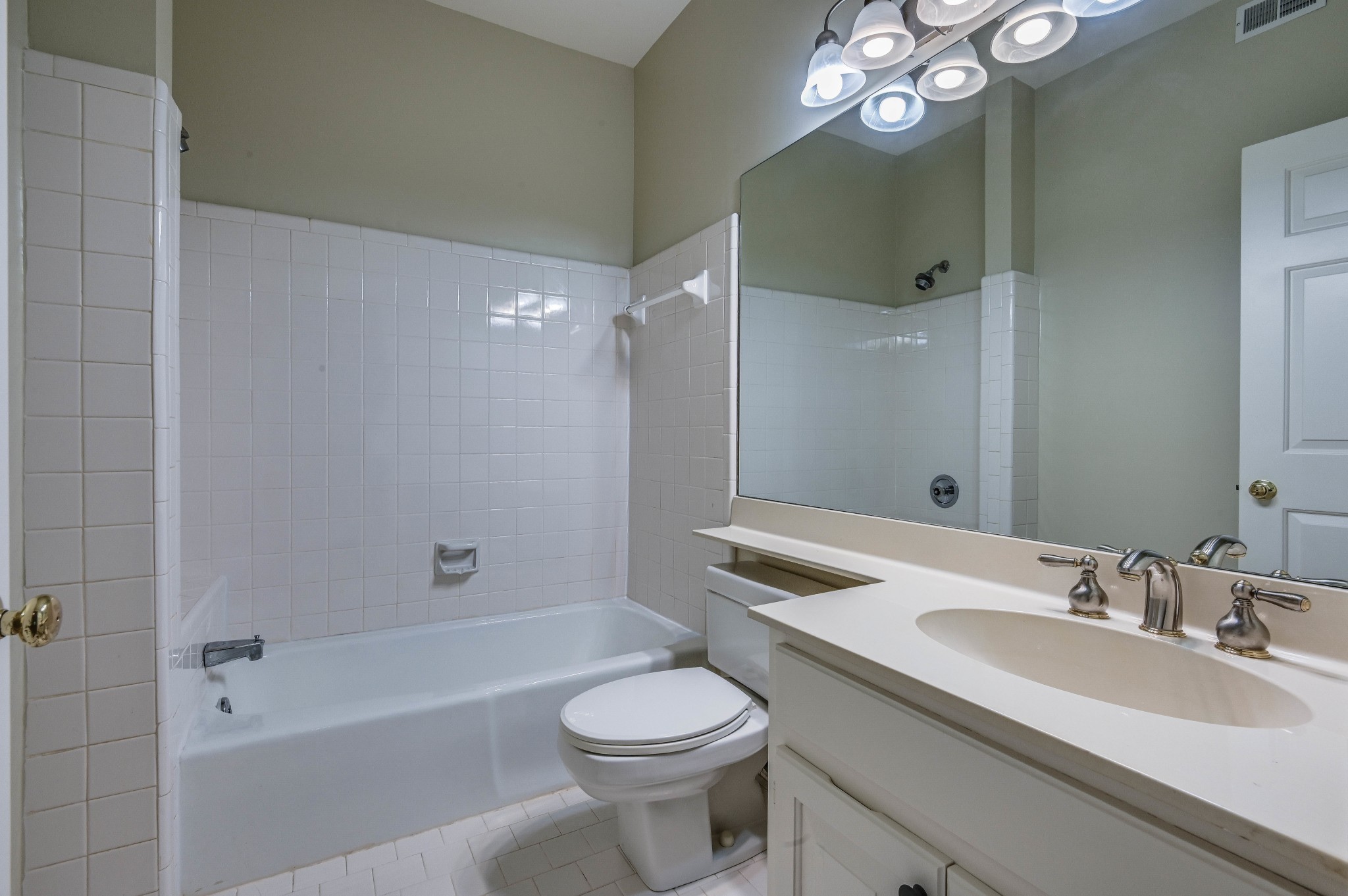 301 Boxmere Place Nashville, TN 37215 - Photo 21 of 40 a bathroom with a sink a toilet and shower