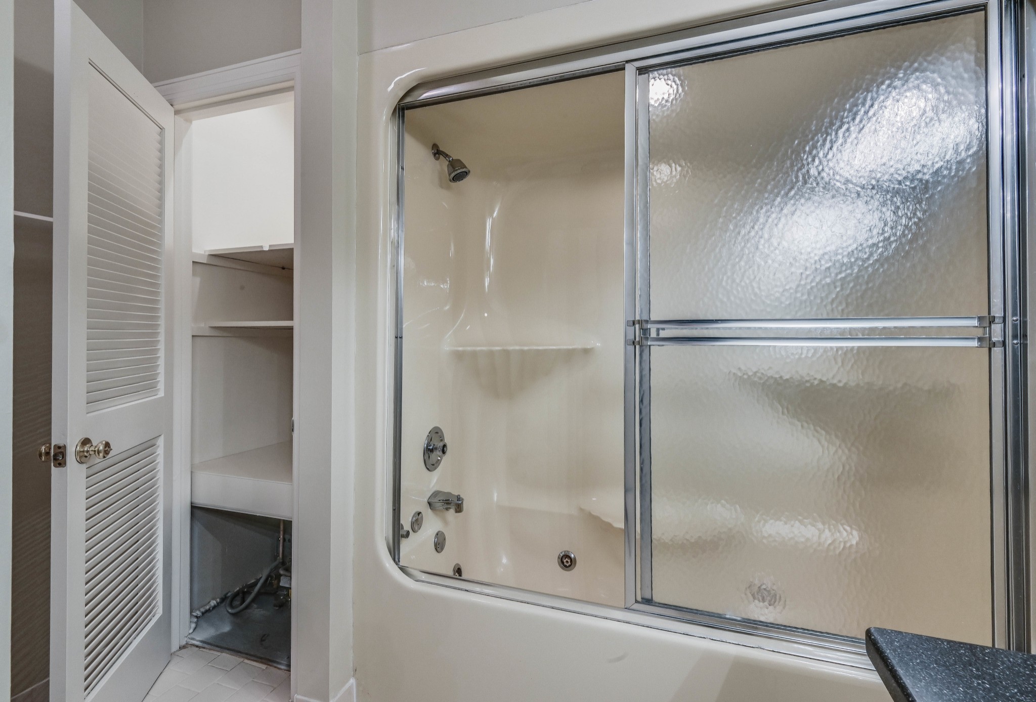 301 Boxmere Place Nashville, TN 37215 - Photo 24 of 40 a bathroom with a glass shower door