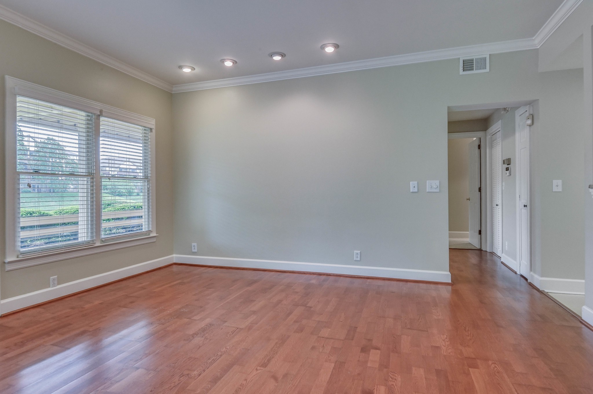 301 Boxmere Place Nashville, TN 37215 - Photo 26 of 40 an empty room with wooden floor and windows