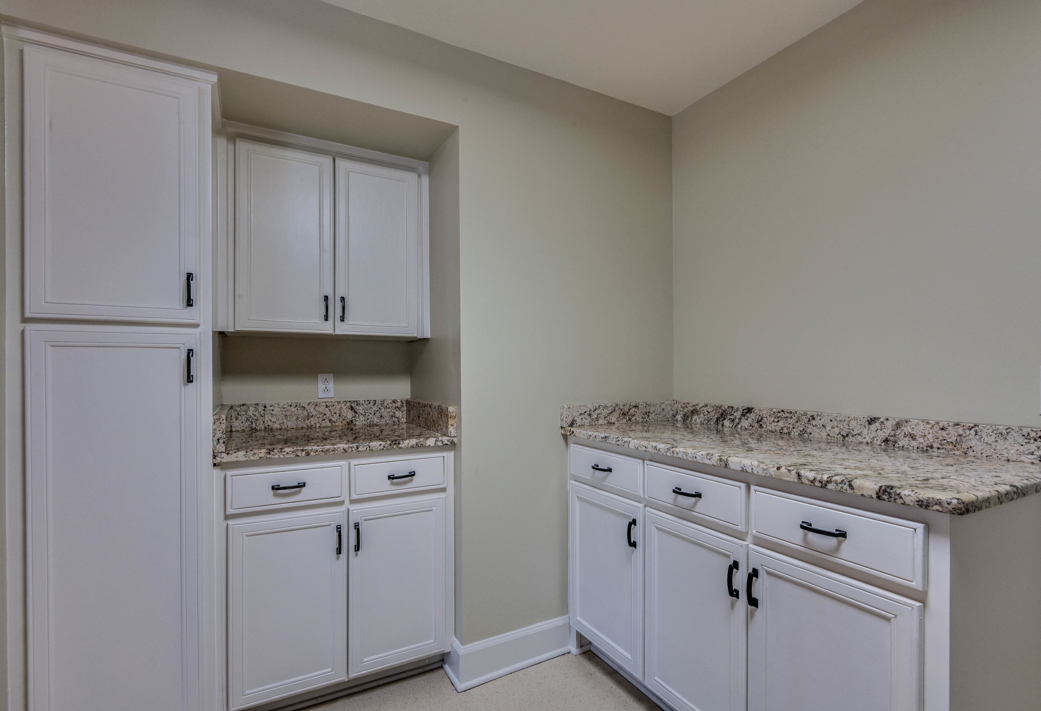 301 Boxmere Place Nashville, TN 37215 - Photo 32 of 40 a kitchen with granite countertop white cabinets and white appliances