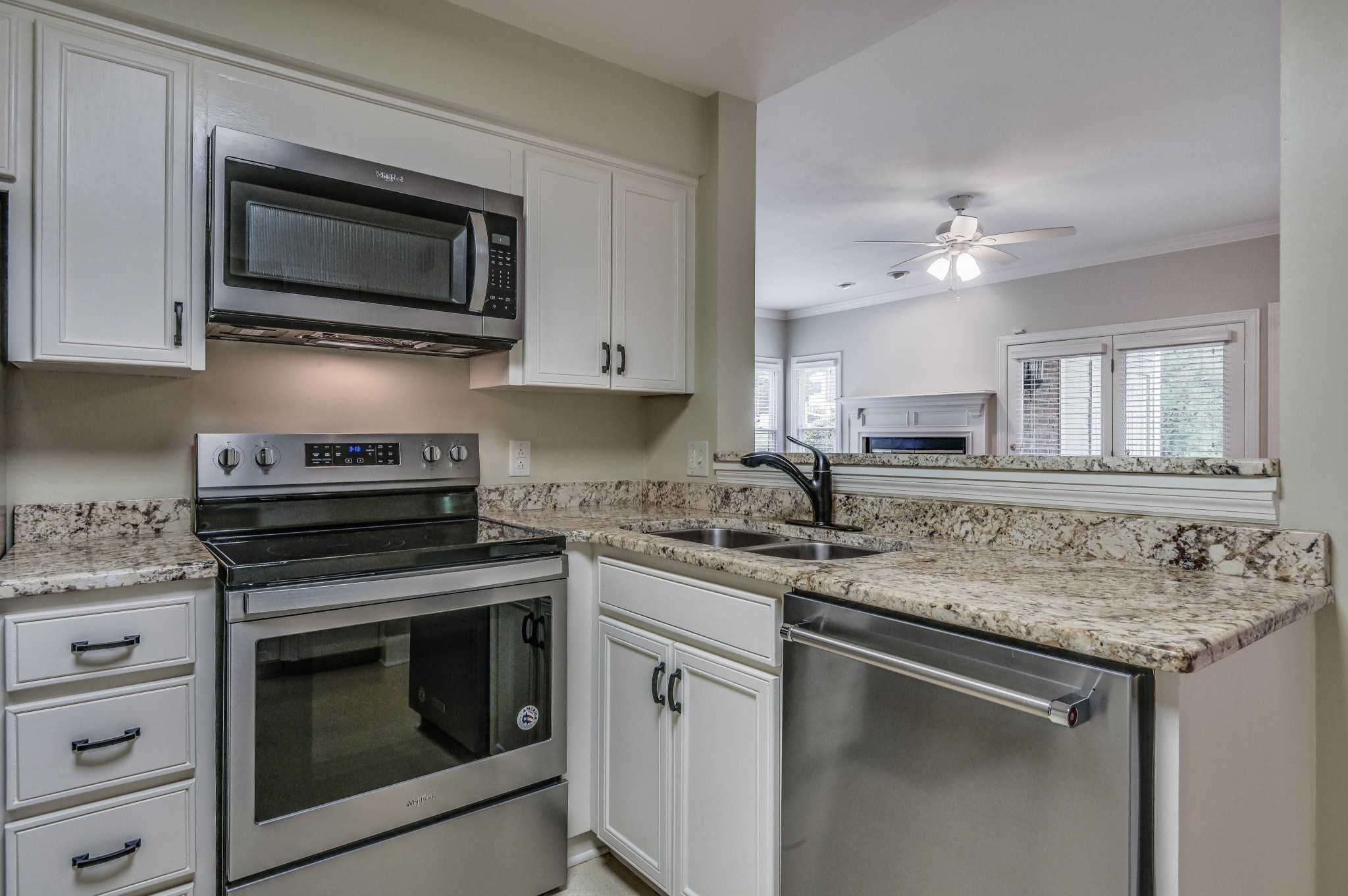 301 Boxmere Place Nashville, TN 37215 - Photo 35 of 40 a kitchen with stainless steel appliances granite countertop a sink stove top oven and microwave