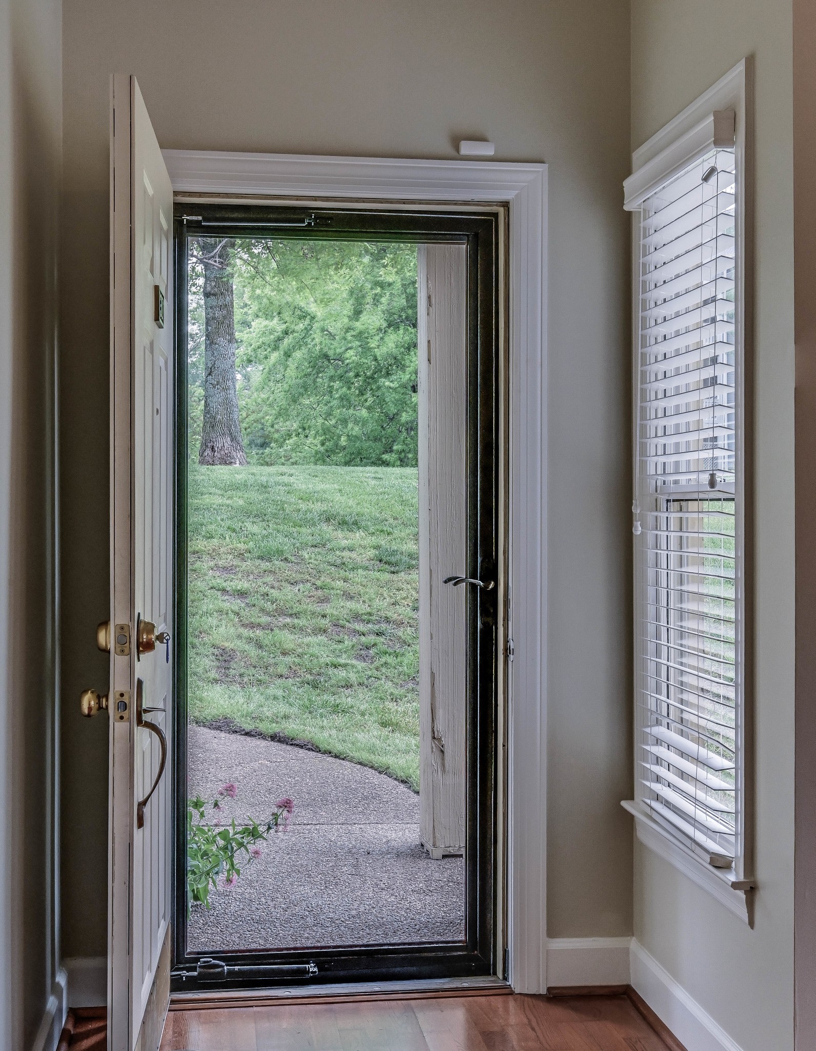 301 Boxmere Place Nashville, TN 37215 - Photo 37 of 40 a view of a porch with a floor to ceiling window and wooden floor