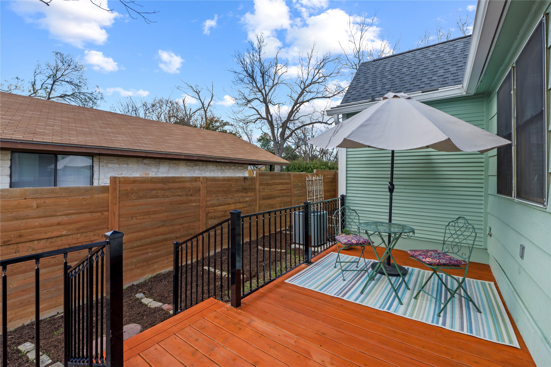 1120 Vance Street Taylor, TX 76574 - Photo 24 of 40 There's a beautiful seating area directly outside the laundry/office room. The cedar and galvanized steel deck was recently installed.