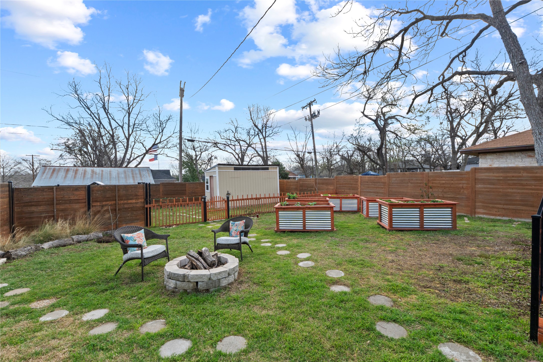 1120 Vance Street Taylor, TX 76574 - Photo 28 of 40 Five raised garden beds offer a multitude of fresh veggies and fruits including mint, strawberries, wheatgrass, spinach and more!