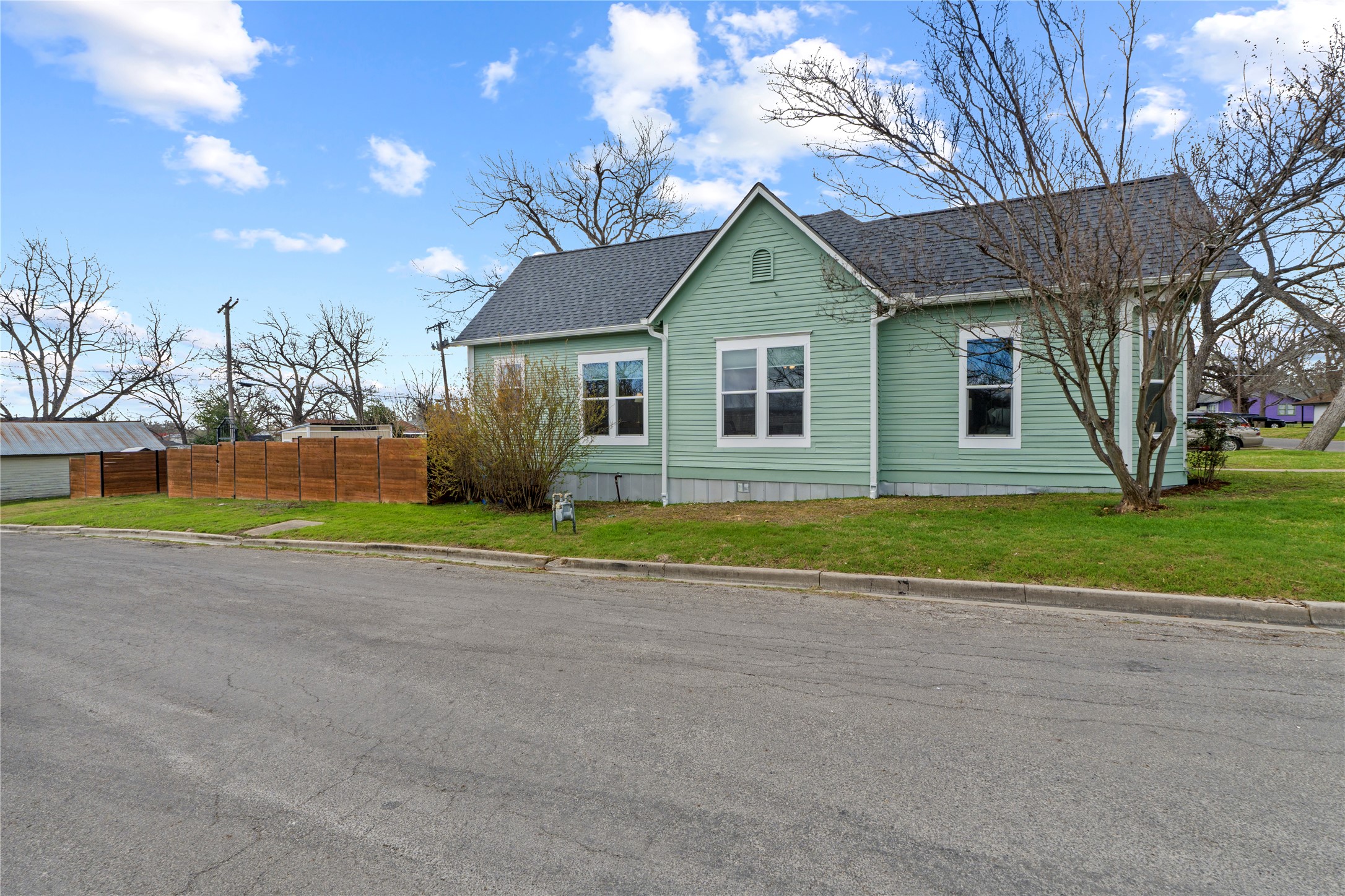 1120 Vance Street Taylor, TX 76574 - Photo 34 of 40 Side of structure from 12th. This home is located on a quiet corner lot!
