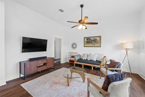 a view of a dining room with furniture and wooden floor