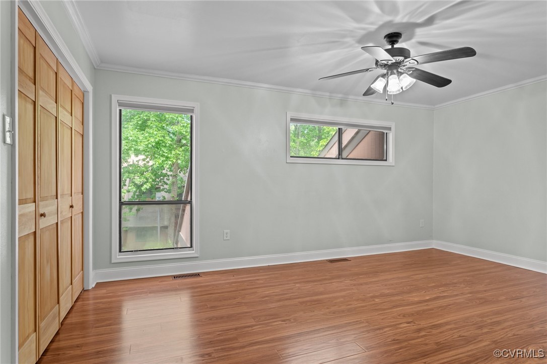 11905 West Briar Patch Drive Midlothian, VA 23113 - Photo 28 of 49 LVP flooring and ceiling fan in primary bedroom