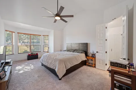 a view of a dining room with furniture and window