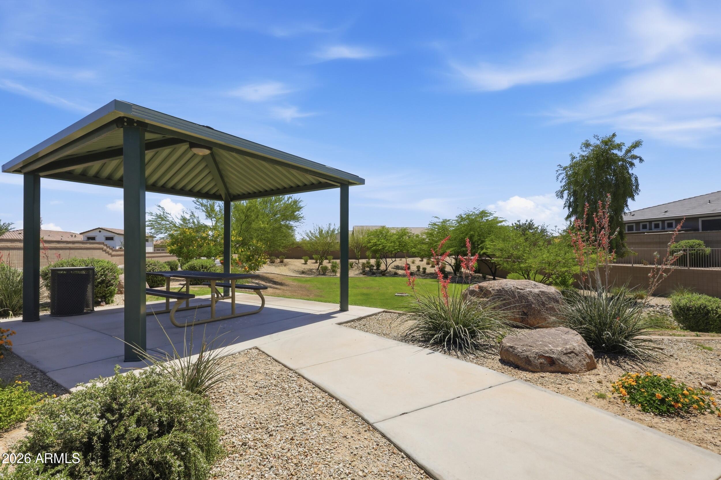 12517 West Lawrence Road Glendale, AZ 85307 - Photo 52 of 52 a view of a backyard with a garden and plants