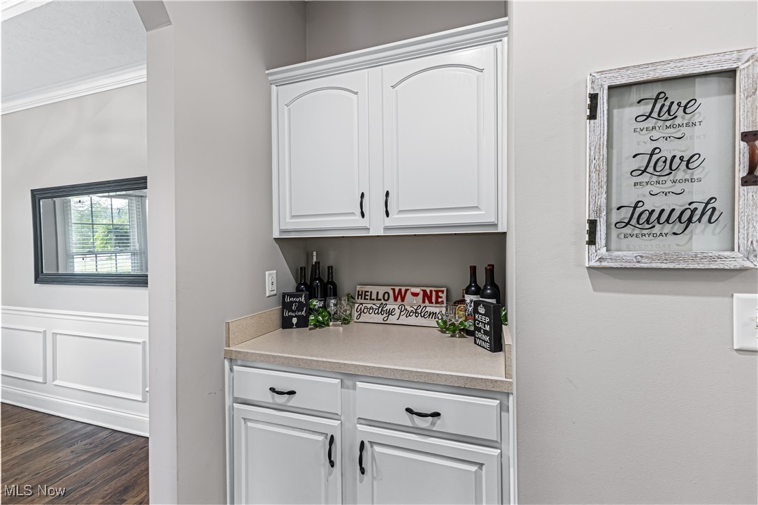 2251 Timber Ridge Trail Streetsboro, OH 44241 - Photo 22 of 48 Bar featuring white cabinets and dark wood-type flooring