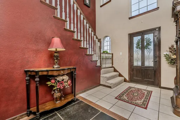 a view of an entryway with wooden floor