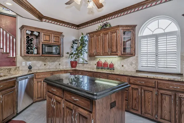 a kitchen that has a sink a window and a counter space