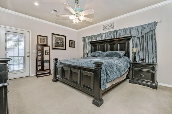 a bedroom with a bed and a fireplace
