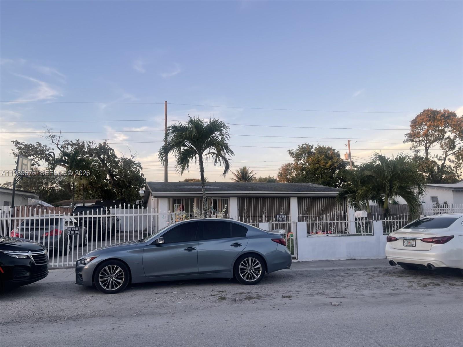 a view of a car parked in front of a house