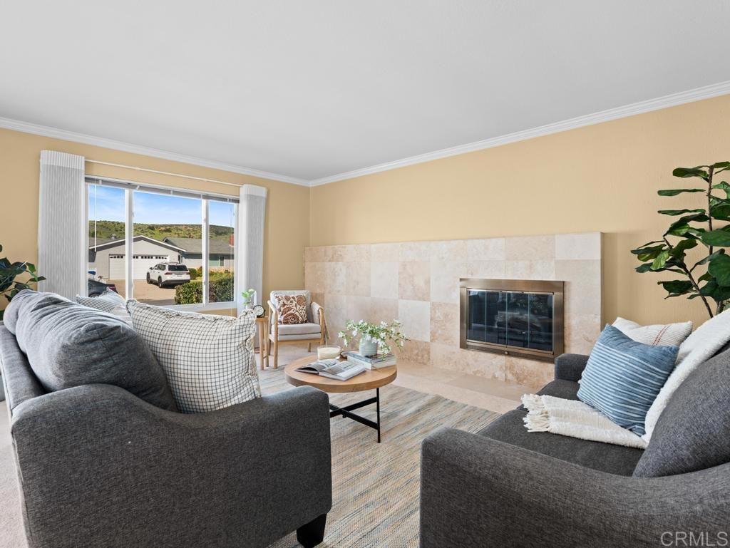 10020 Stanley Court Santee, CA 92071 - Photo 2 of 27 a living room with furniture and a fireplace