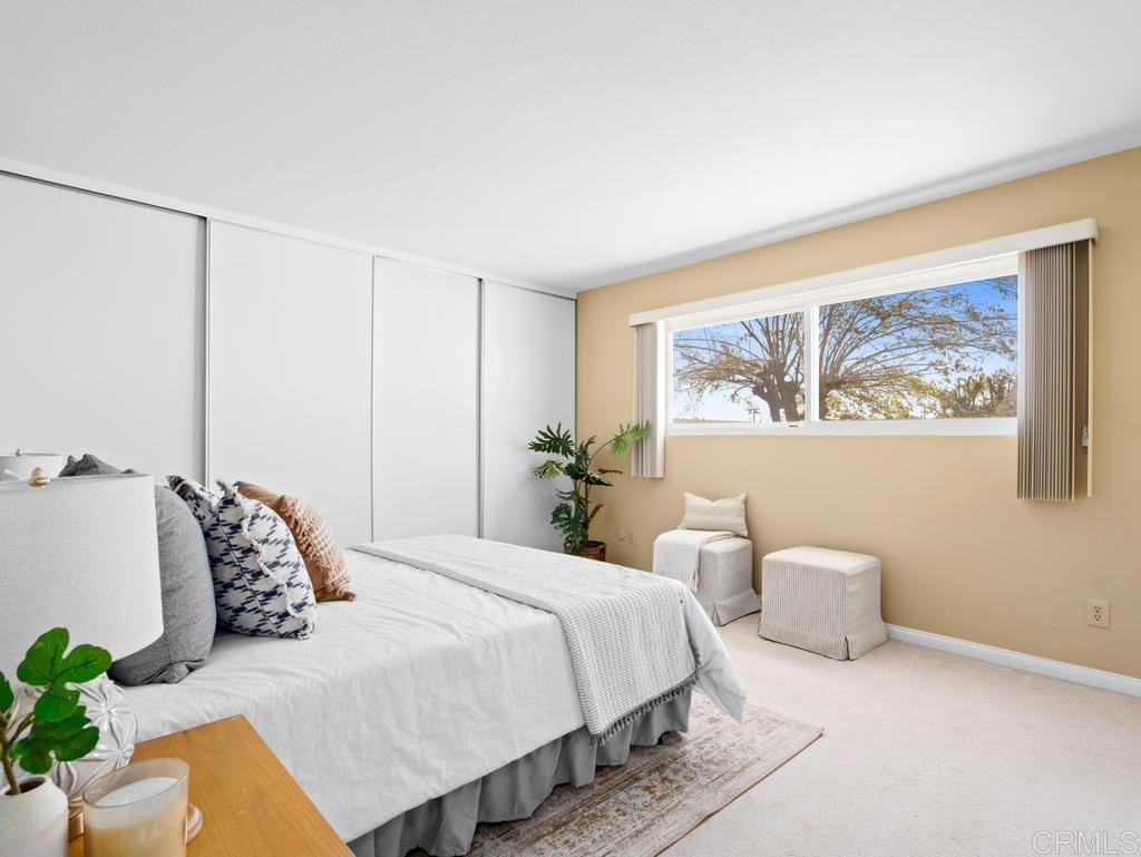 10020 Stanley Court Santee, CA 92071 - Photo 9 of 27 a bedroom with a bed and a painting on the wall