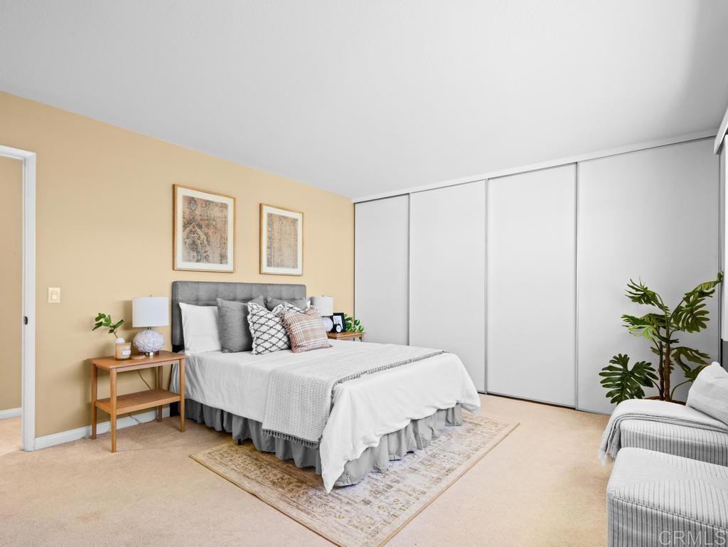 10020 Stanley Court Santee, CA 92071 - Photo 10 of 27 a bedroom with a bed and a couch