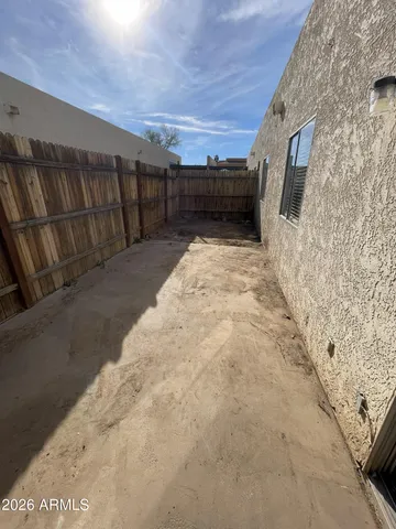 a view of a street with a house in front of it