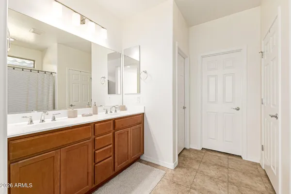 a bathroom with a double vanity sink mirror and double