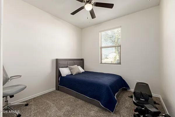 a bedroom with a bed and window