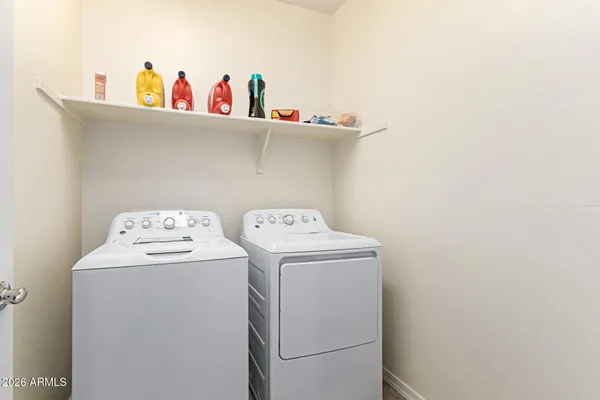 a utility room with dryer and washer